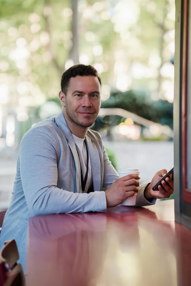 Profile picture of Alvin Miller having a cup of coffee